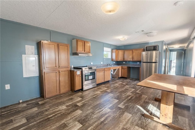 kitchen with stainless steel appliances, a textured ceiling, electric panel, and dark hardwood / wood-style flooring