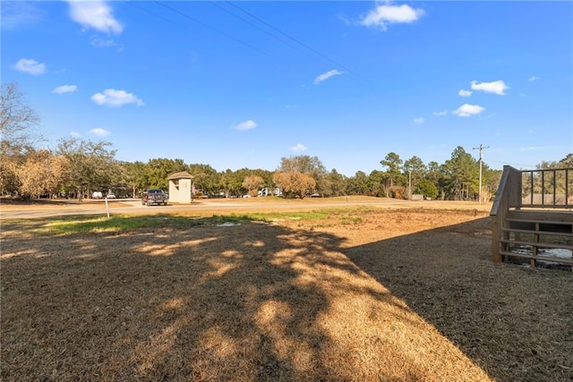 view of yard with a rural view