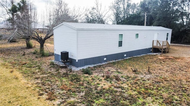 view of side of property featuring central AC