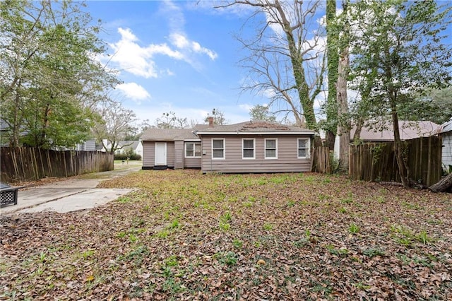 back of property with fence