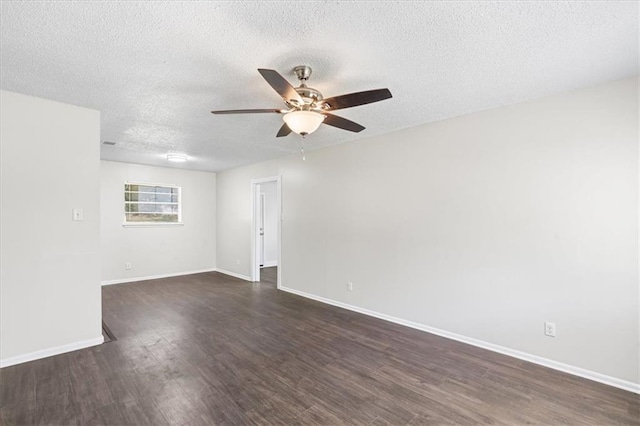 unfurnished room with dark wood finished floors, a textured ceiling, a ceiling fan, and baseboards