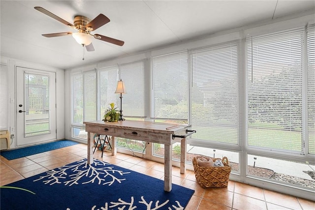 tiled office with plenty of natural light and ceiling fan