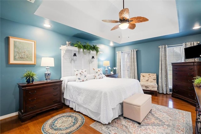 bedroom featuring ceiling fan and dark wood-type flooring