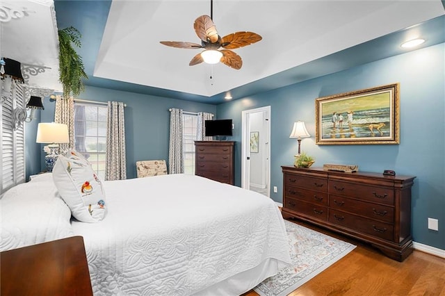 bedroom featuring light wood-type flooring and ceiling fan