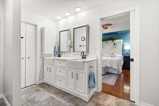 bathroom with vanity and wood-type flooring