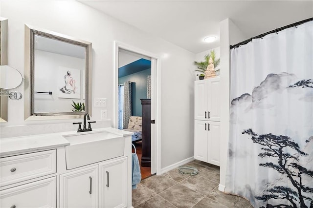 bathroom with tile patterned flooring and vanity