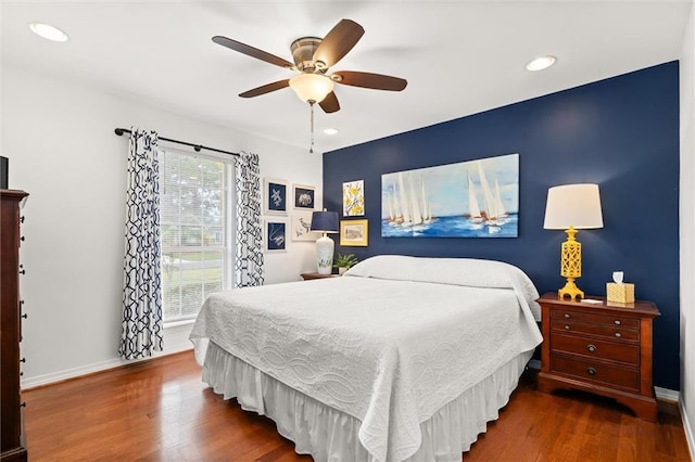 bedroom featuring hardwood / wood-style floors and ceiling fan