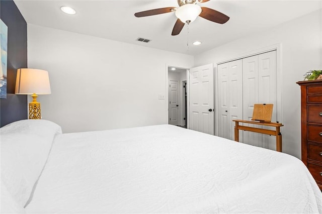 bedroom featuring ceiling fan and a closet