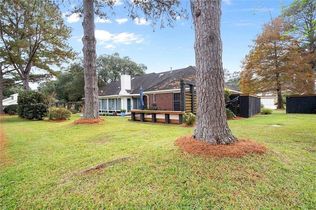 view of yard with a storage shed