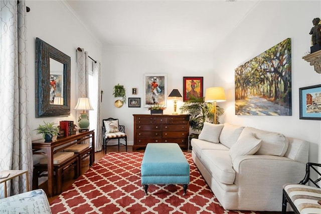 sitting room with ornamental molding and hardwood / wood-style flooring