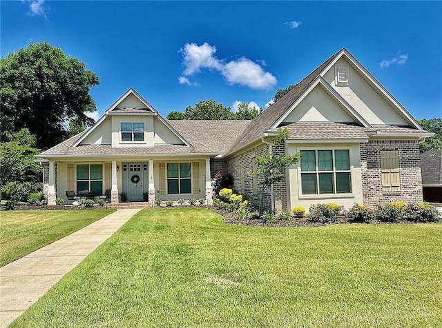 craftsman-style home featuring a front lawn