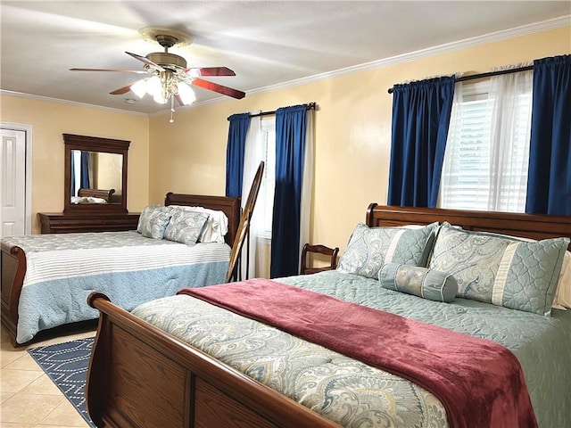 bedroom with ceiling fan, light tile patterned flooring, and ornamental molding