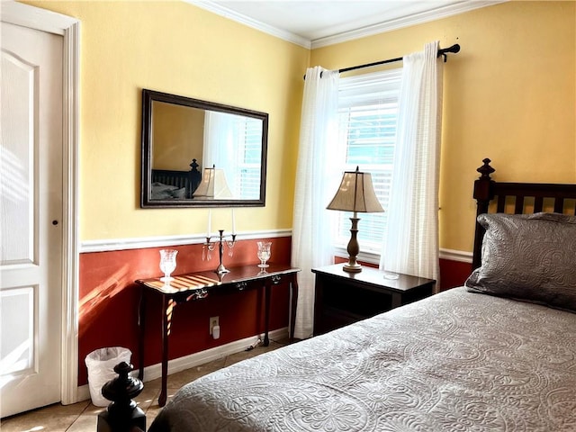 bedroom with tile patterned flooring and ornamental molding