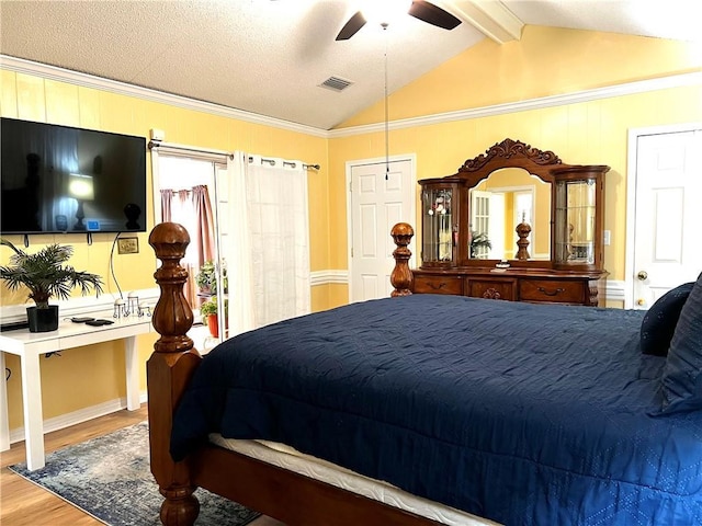 bedroom featuring vaulted ceiling with beams, ceiling fan, wood-type flooring, and ornamental molding