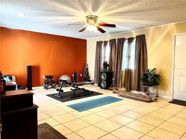 workout area featuring crown molding, light tile patterned floors, and a textured ceiling