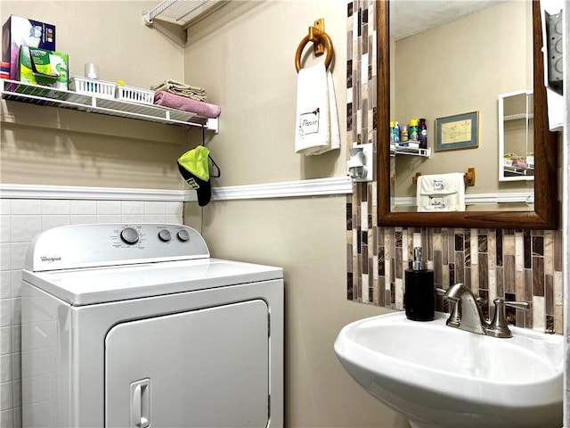 laundry room featuring sink and washer / clothes dryer