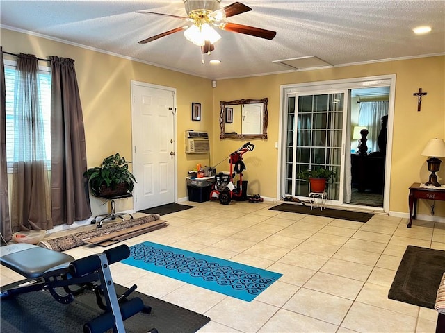 workout area featuring light tile patterned floors, a textured ceiling, and ornamental molding