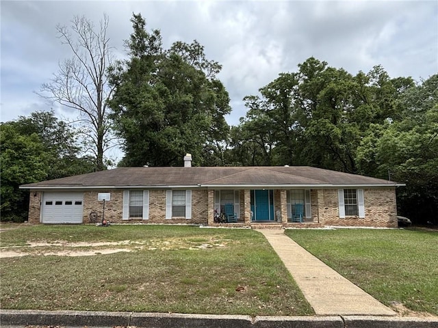1205 Cadiz St, Mobile, AL 36693 - single story home with covered porch, an attached garage, a front lawn, and brick siding