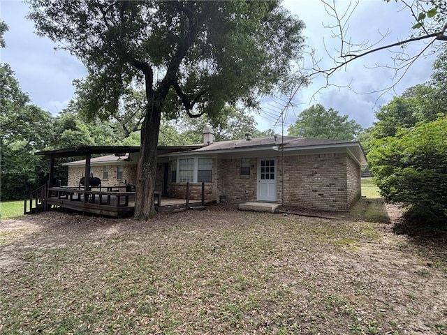 1205 Cadiz St, Mobile, AL 36693 - rear view of property with a wooden deck and brick siding