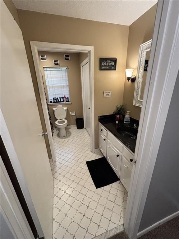 1205 Cadiz St, Mobile, AL 36693 - half bathroom with vanity, tile patterned floors, toilet, and visible vents
