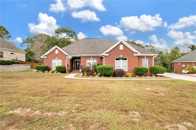 ranch-style home with a front lawn