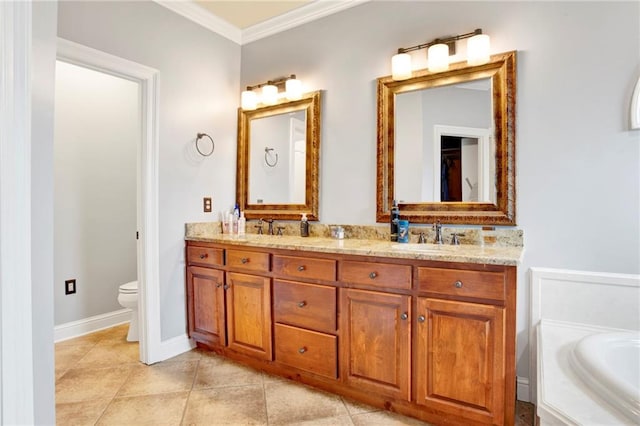 bathroom featuring tile patterned floors, toilet, ornamental molding, a bathtub, and vanity