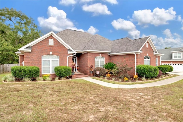 view of front facade with a garage and a front yard