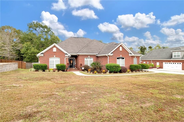 view of front of home featuring a front yard and a garage