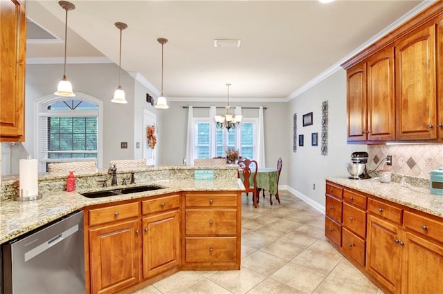 kitchen featuring dishwasher, a wealth of natural light, sink, and a notable chandelier