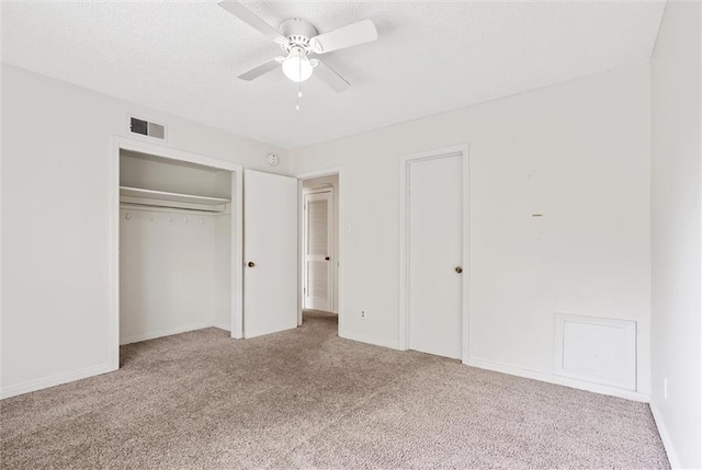 unfurnished bedroom featuring ceiling fan and light colored carpet