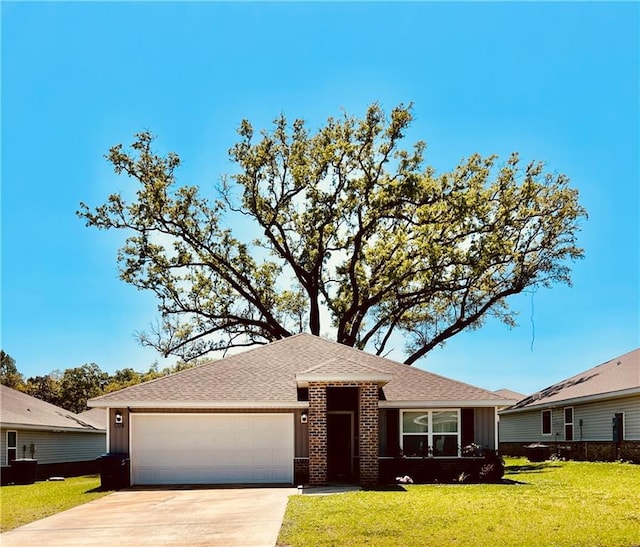 6157 Stream Bank Dr, Mobile, AL 36582 - view of front of property with a garage, a front lawn, brick siding, a shingled roof, and concrete driveway
