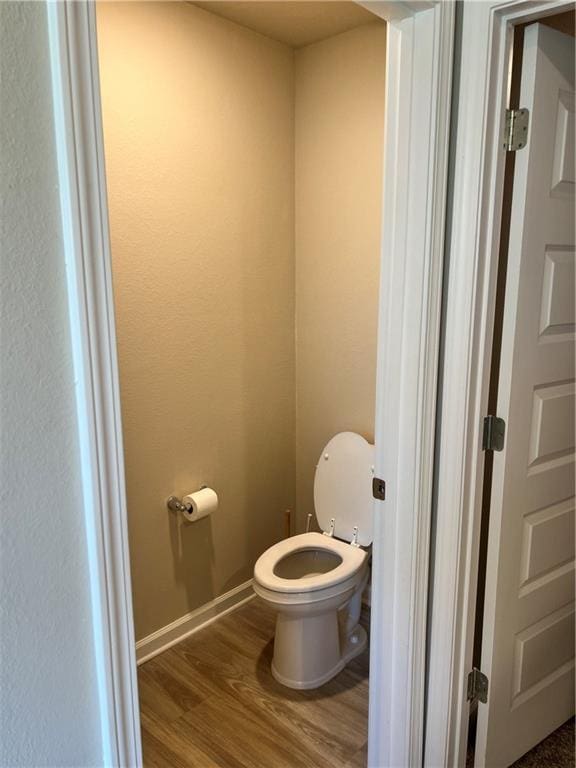 6157 Stream Bank Dr, Mobile, AL 36582 - bathroom with toilet, wood finished floors, and baseboards