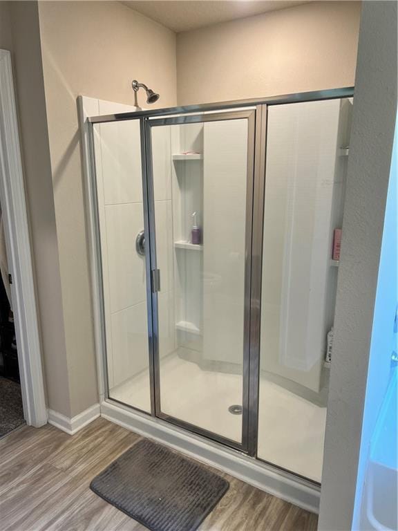 6157 Stream Bank Dr, Mobile, AL 36582 - full bathroom with a shower stall and wood finished floors