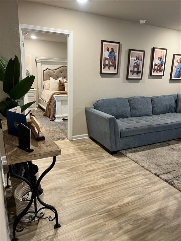 6157 Stream Bank Dr, Mobile, AL 36582 - living room with light wood finished floors and baseboards
