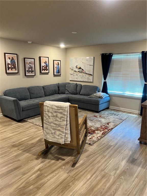 6157 Stream Bank Dr, Mobile, AL 36582 - living room with baseboards and light wood finished floors