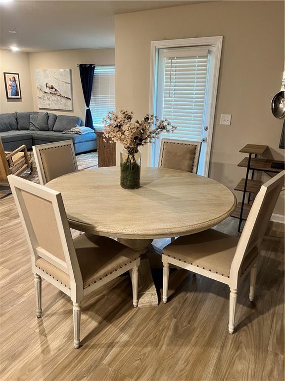 6157 Stream Bank Dr, Mobile, AL 36582 - dining area with light wood-style floors