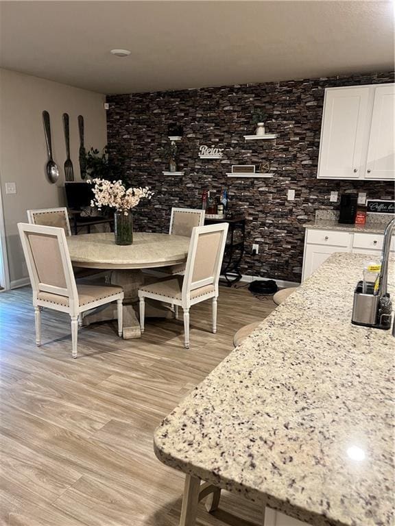 6157 Stream Bank Dr, Mobile, AL 36582 - dining area featuring light wood finished floors