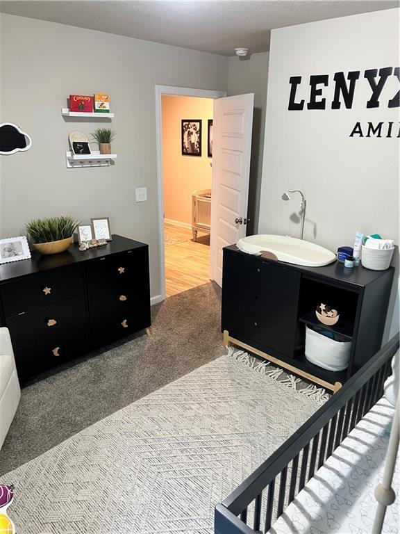 6157 Stream Bank Dr, Mobile, AL 36582 - bedroom with a sink and carpet floors
