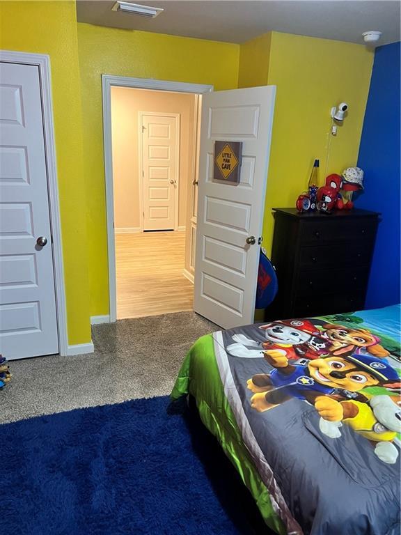 6157 Stream Bank Dr, Mobile, AL 36582 - bedroom featuring baseboards and carpet flooring