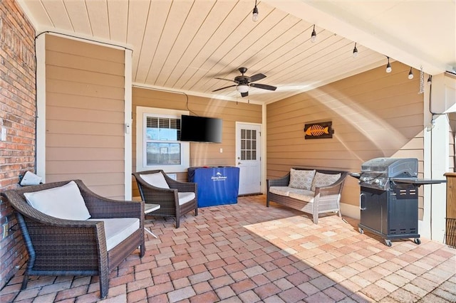 view of patio with a ceiling fan and grilling area