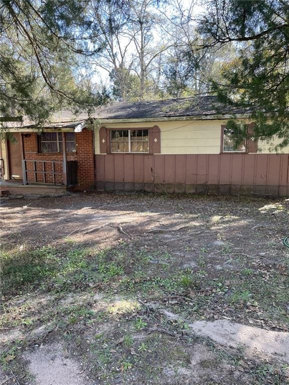 view of side of property with a porch