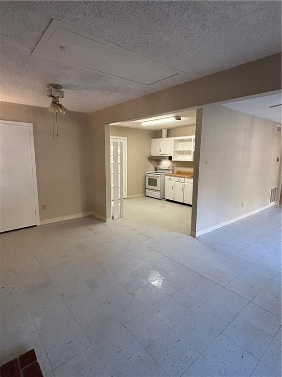 unfurnished living room with a textured ceiling