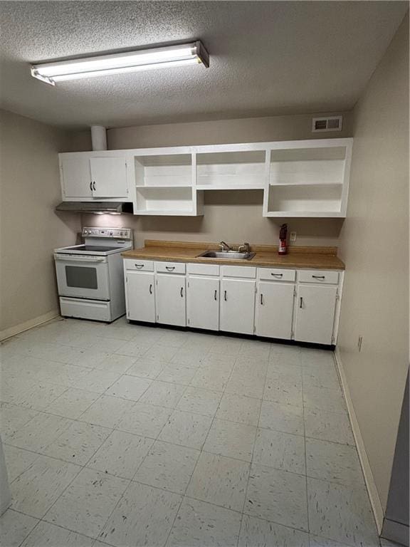 kitchen with white cabinetry, electric range, sink, and a textured ceiling