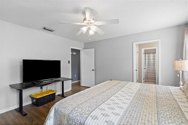 3660 Ching Dairy Rd, Mobile, AL 36618 - bedroom featuring dark wood-style flooring, a textured ceiling, ceiling fan, and baseboards