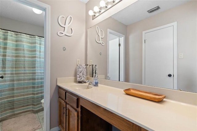 3660 Ching Dairy Rd, Mobile, AL 36618 - full bath featuring vanity, toilet, tile patterned flooring, and a shower with shower curtain