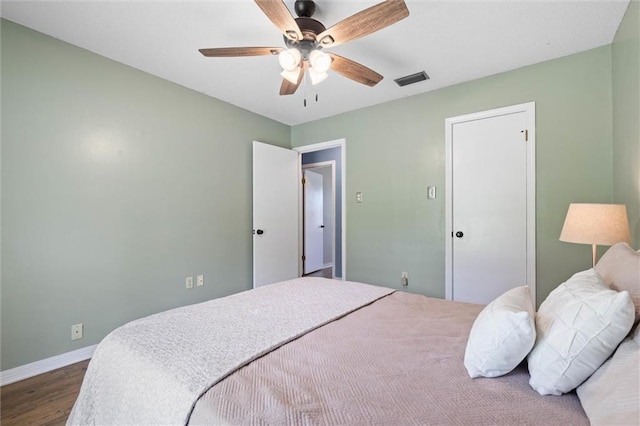 3660 Ching Dairy Rd, Mobile, AL 36618 - bedroom with dark wood-style flooring, baseboards, and a ceiling fan