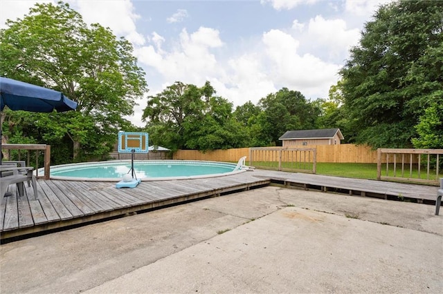 3660 Ching Dairy Rd, Mobile, AL 36618 - view of swimming pool with a wooden deck and a fenced backyard