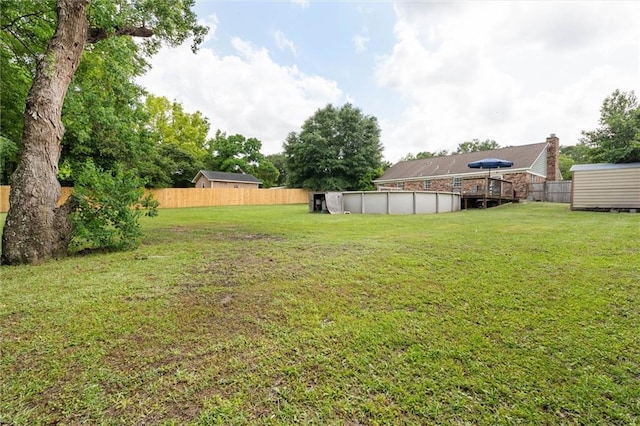 3660 Ching Dairy Rd, Mobile, AL 36618 - view of yard featuring an outdoor pool, a storage shed, and a wooden deck