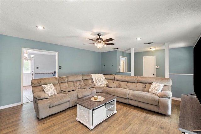 3660 Ching Dairy Rd, Mobile, AL 36618 - living area with light wood-type flooring, baseboards, a chandelier, recessed lighting, and a textured ceiling