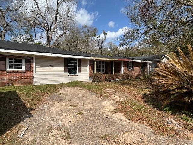 single story home with brick siding